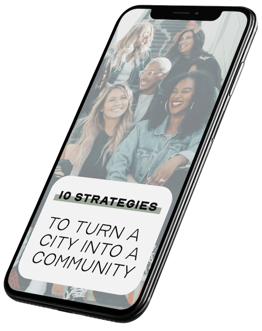 iphone with text "10 Strategies to turn a city into a community"